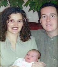Tara and Stephen holding their child (Image via WDIV-TV)